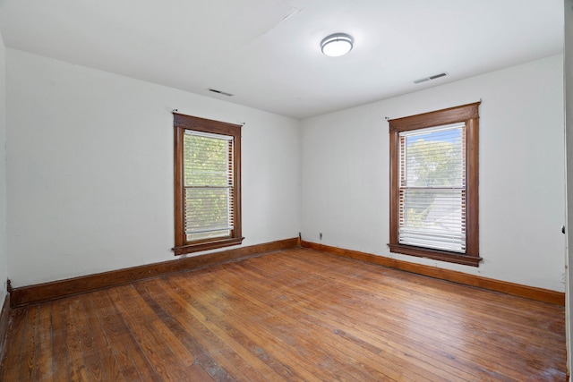 empty room featuring wood-type flooring