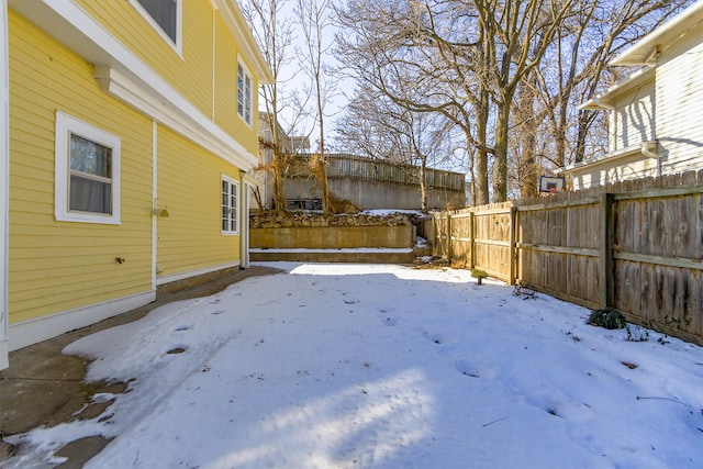 view of yard layered in snow