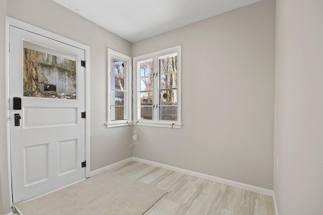 doorway to outside featuring light wood-type flooring