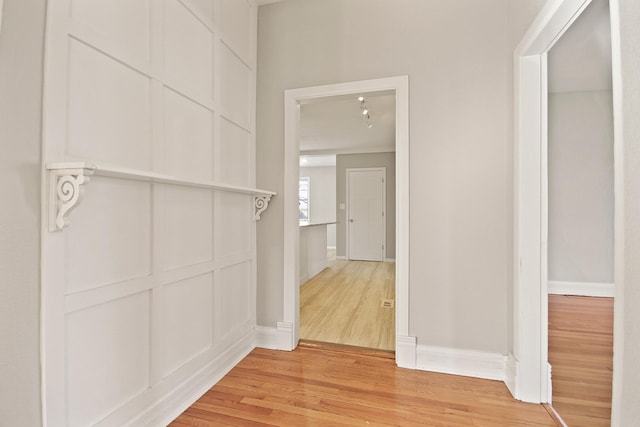 corridor featuring light hardwood / wood-style flooring