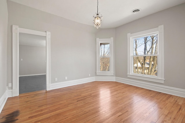 interior space featuring hardwood / wood-style flooring and a chandelier