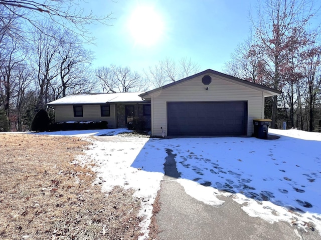 single story home featuring a garage