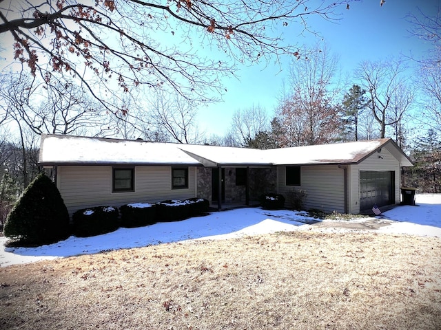 single story home featuring a garage