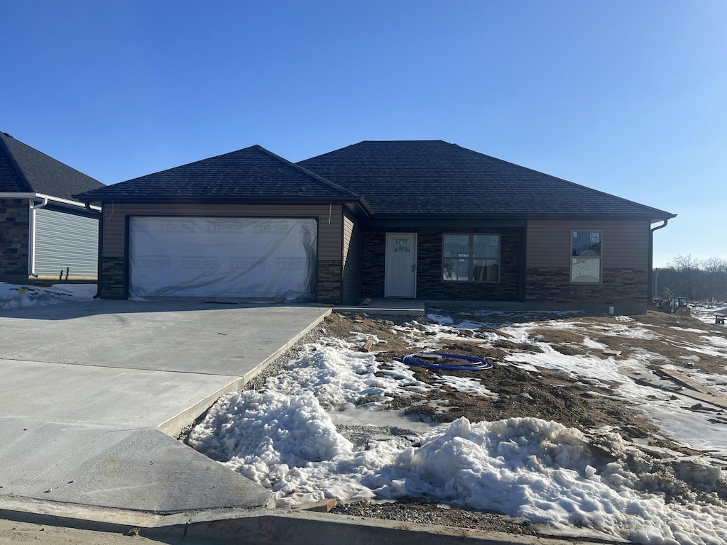 ranch-style house featuring a garage