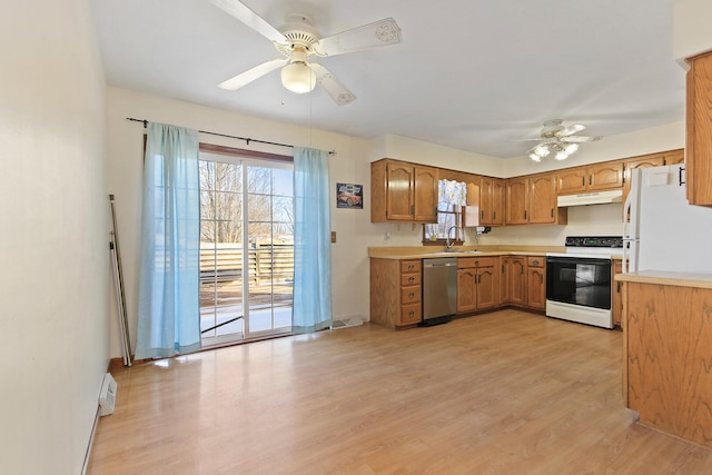 kitchen featuring dishwasher, sink, white refrigerator, electric range, and ceiling fan