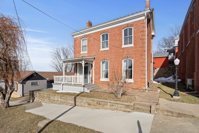 view of front of house featuring cooling unit and a porch