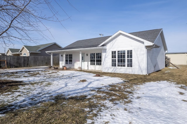 view of snow covered house