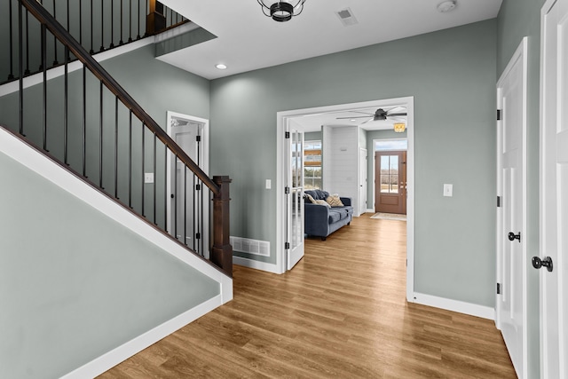 entryway featuring ceiling fan and wood-type flooring