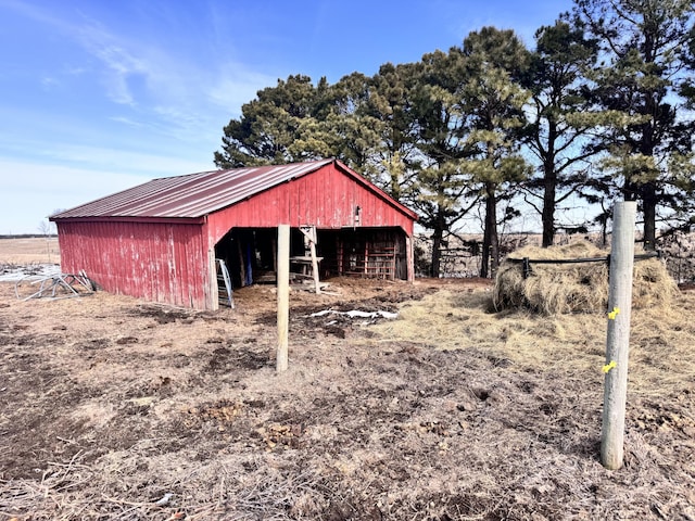 view of outbuilding with a rural view