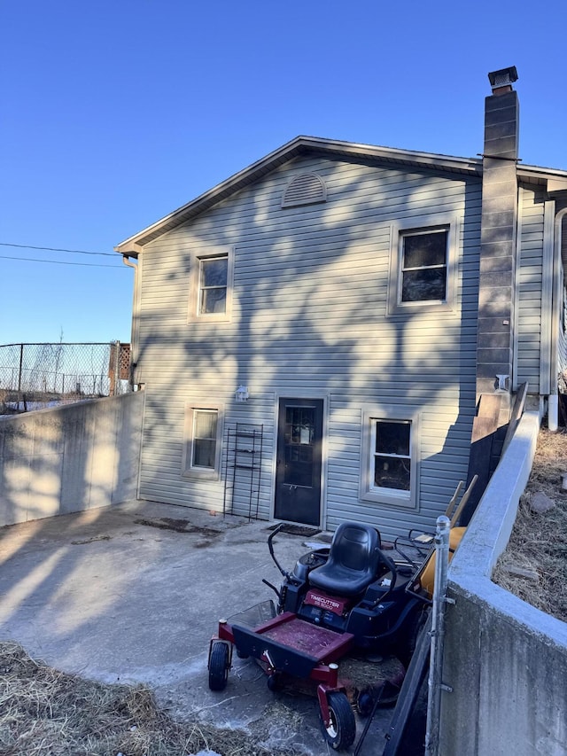 rear view of property featuring a patio area