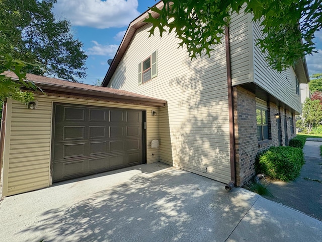 view of property exterior with a garage