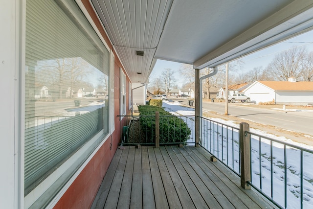 view of snow covered deck