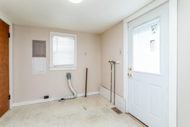 washroom featuring hookup for a washing machine and a wealth of natural light