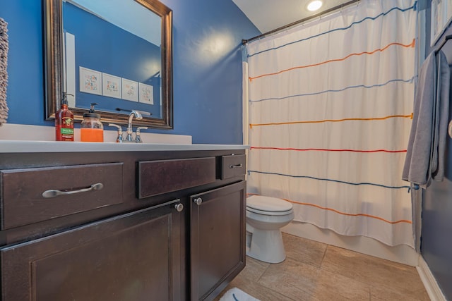 full bathroom with vanity, shower / bath combo with shower curtain, and toilet