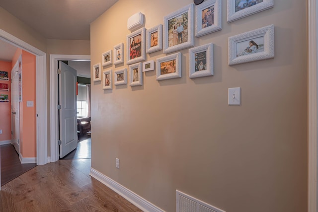 hall with dark hardwood / wood-style floors