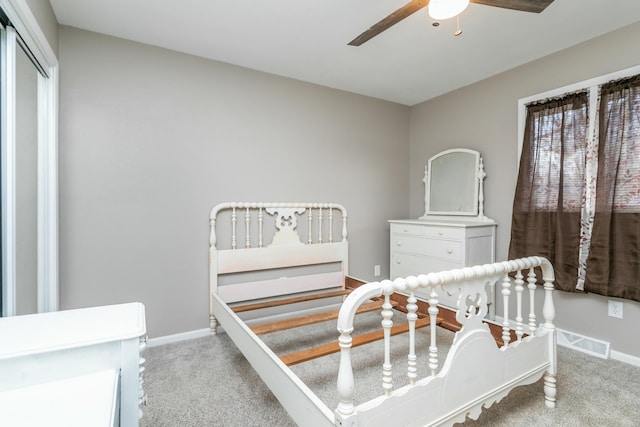 carpeted bedroom featuring ceiling fan