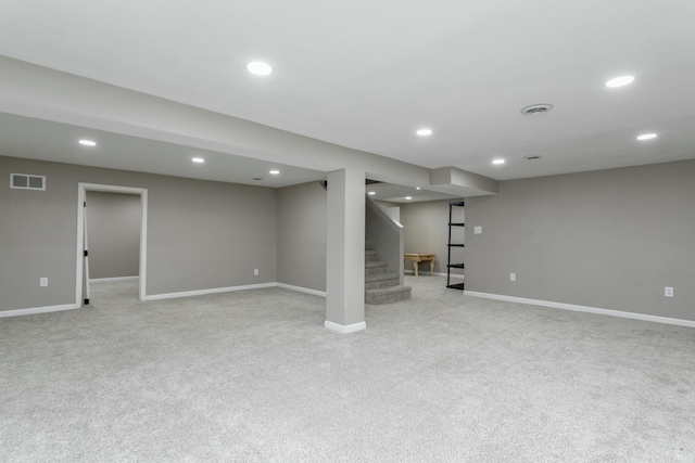 basement featuring light colored carpet