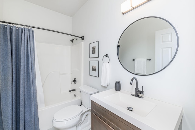 full bathroom with vanity, shower / bath combination with curtain, and toilet