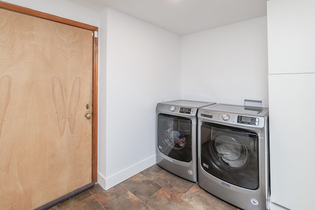 laundry room featuring separate washer and dryer