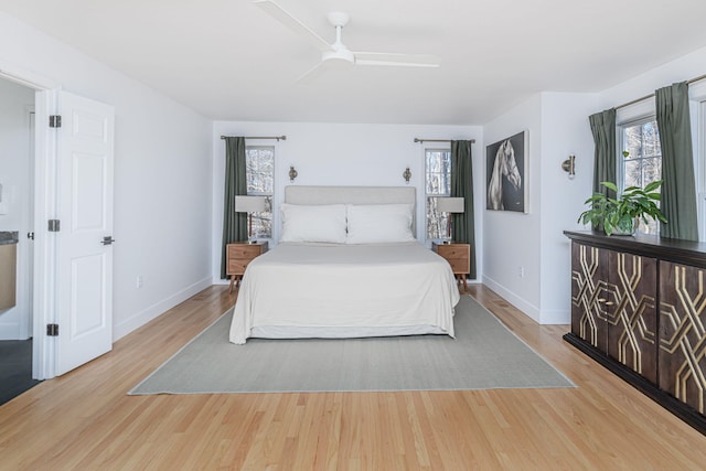 bedroom with light hardwood / wood-style flooring and ceiling fan