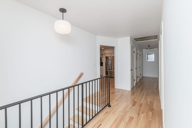 hall with light hardwood / wood-style floors