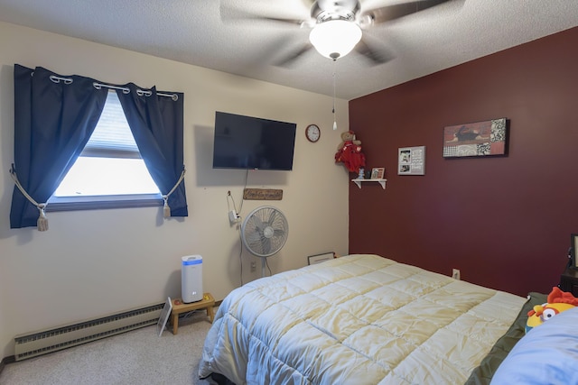 bedroom featuring ceiling fan, carpet floors, a textured ceiling, and baseboard heating