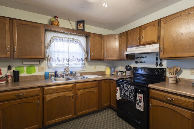 kitchen with black electric range oven, sink, and a textured ceiling