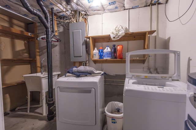 laundry area with separate washer and dryer and electric panel