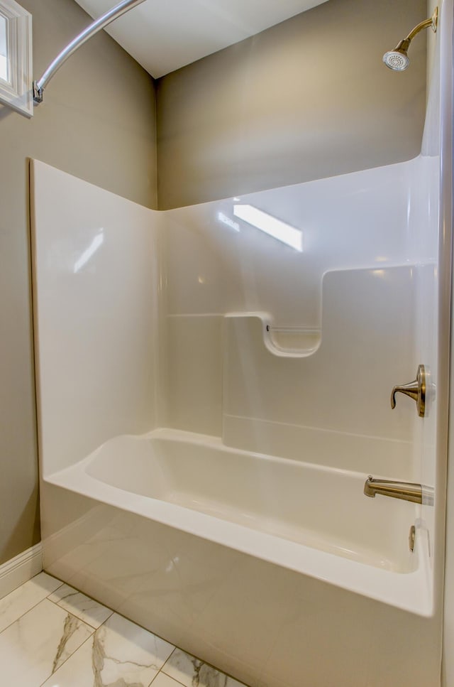 bathroom with washtub / shower combination