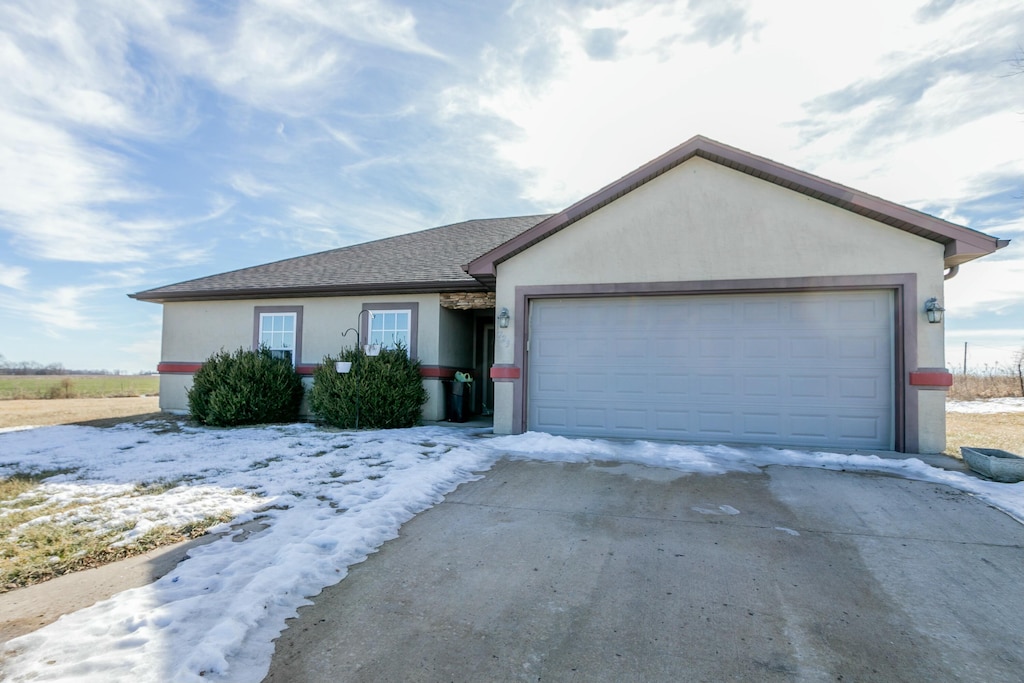 ranch-style house featuring a garage