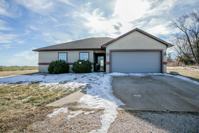 ranch-style home with a garage