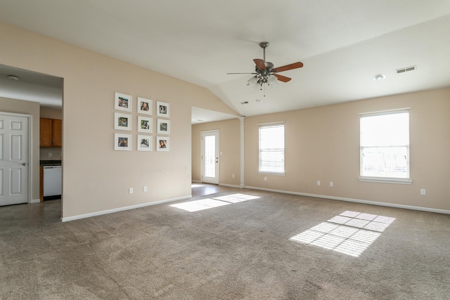 spare room with ceiling fan, carpet flooring, and vaulted ceiling