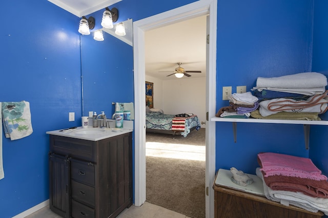 bathroom featuring ceiling fan and vanity