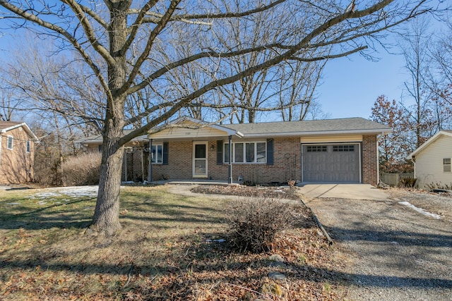 single story home featuring a garage and a front yard