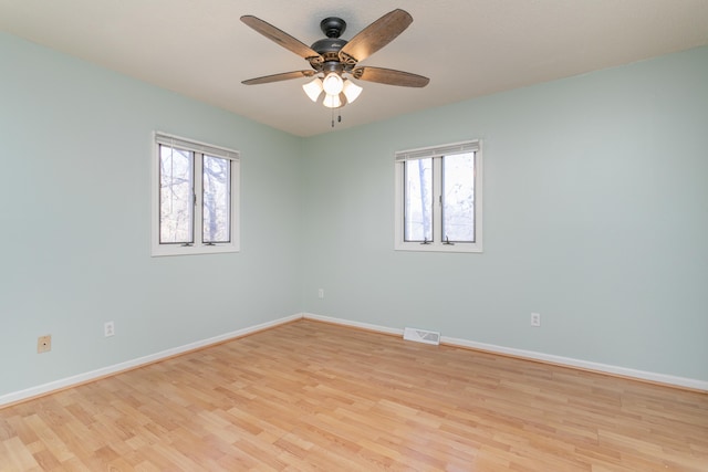 unfurnished room with ceiling fan and light hardwood / wood-style flooring