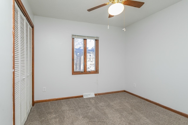 unfurnished bedroom with a closet, ceiling fan, and carpet