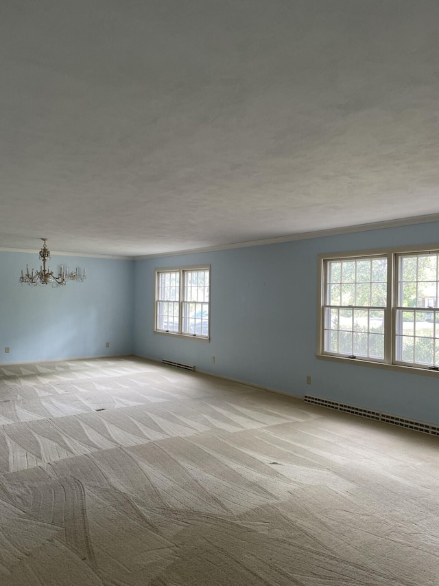 unfurnished room with light carpet, crown molding, and baseboard heating