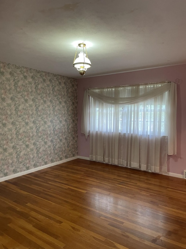 unfurnished room featuring dark hardwood / wood-style floors