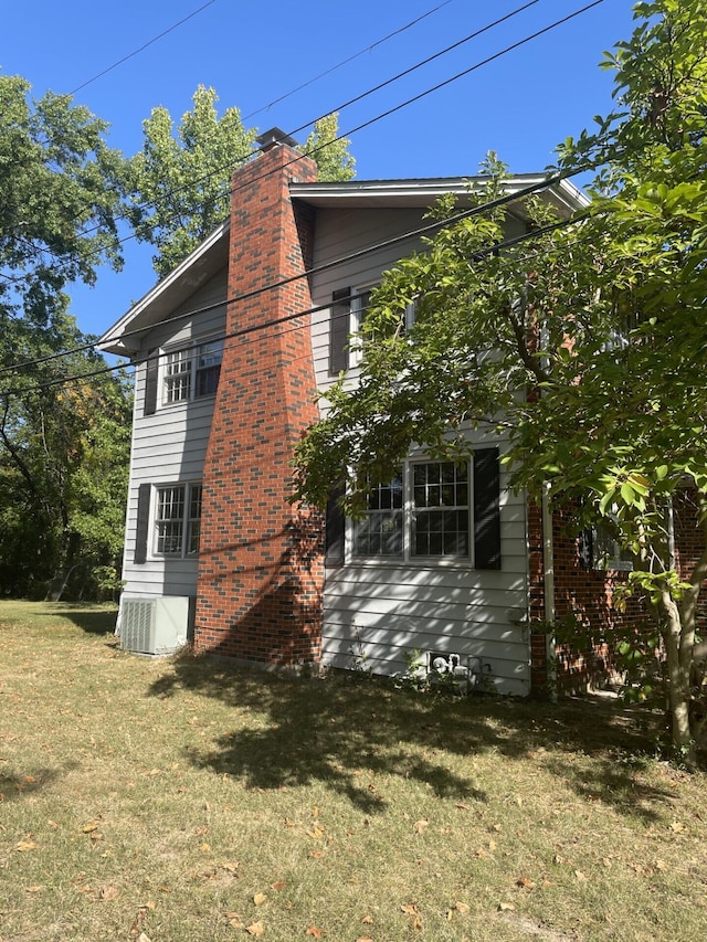 view of home's exterior featuring a lawn