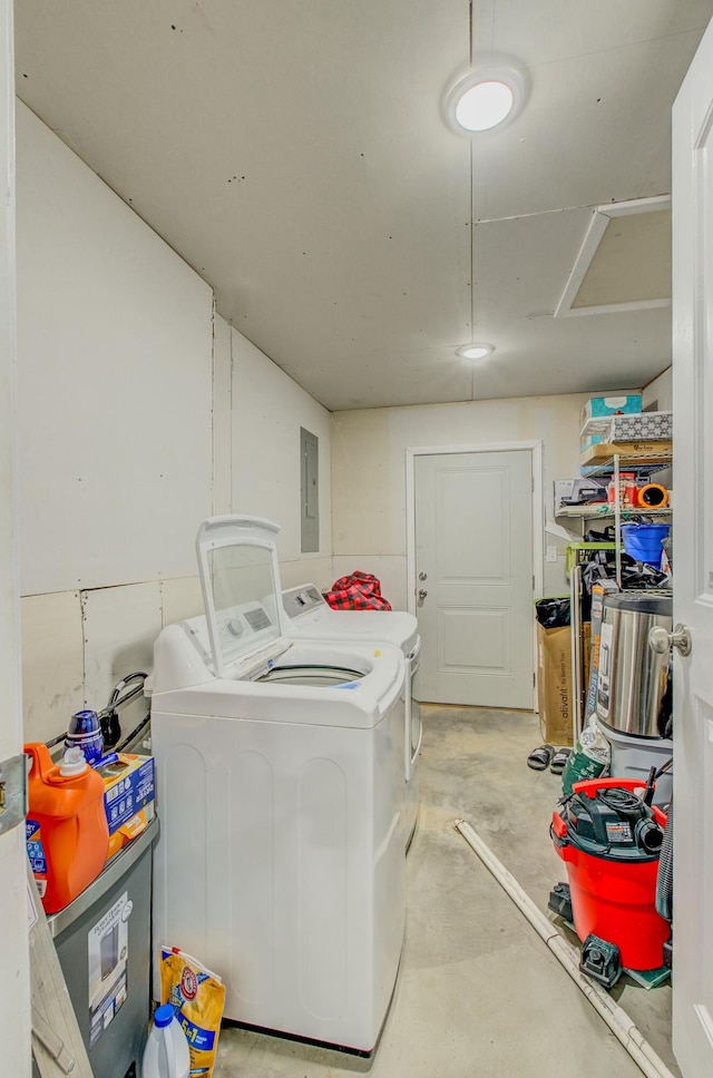 laundry area with washing machine and dryer and electric panel