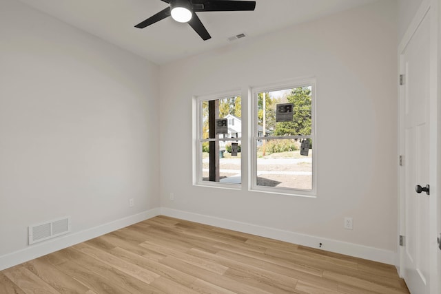 spare room featuring ceiling fan and light wood-type flooring