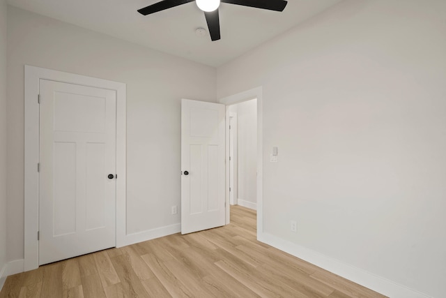 unfurnished bedroom with light hardwood / wood-style flooring and ceiling fan