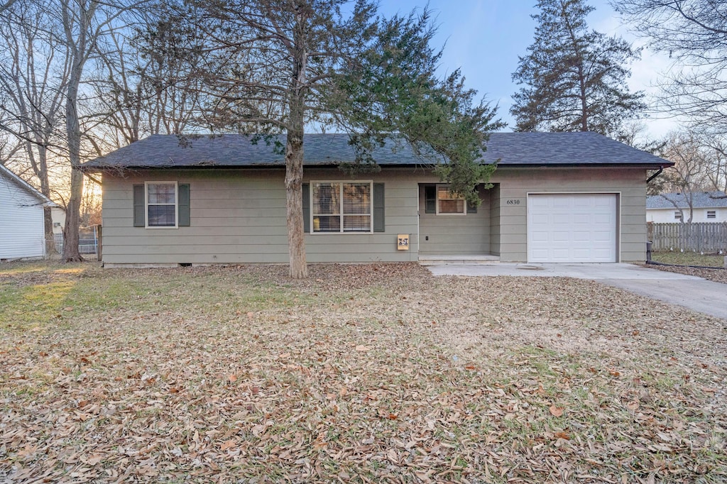 single story home with a garage