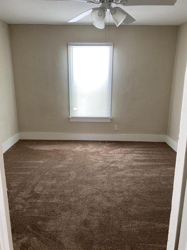 empty room with carpet and ceiling fan