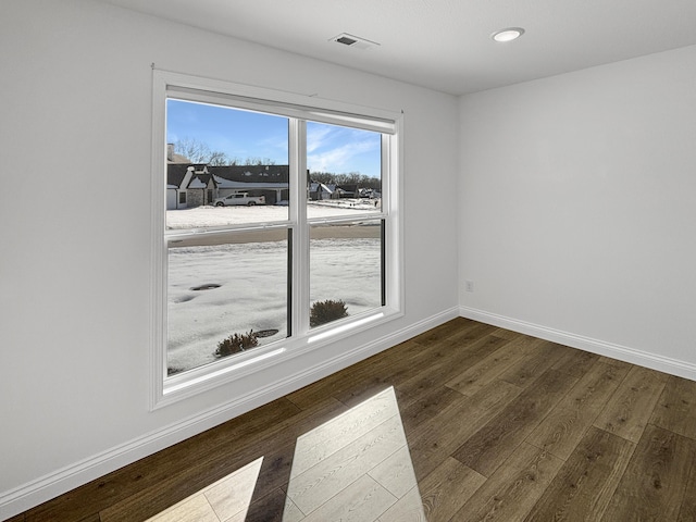 unfurnished room featuring hardwood / wood-style floors