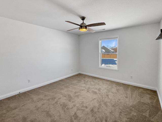 empty room with carpet flooring and ceiling fan