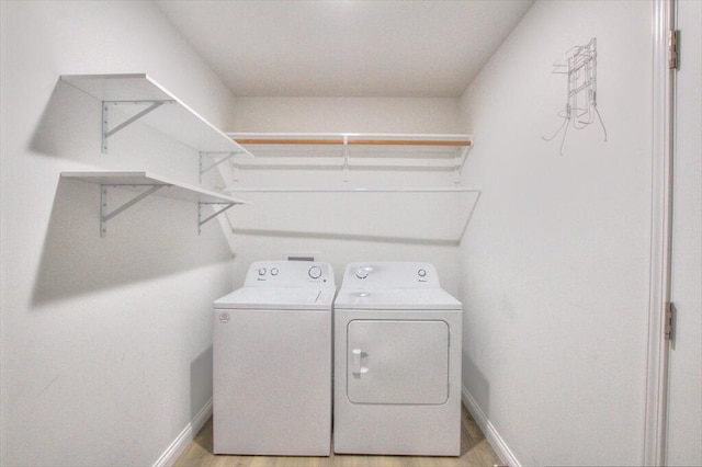 laundry area featuring washing machine and clothes dryer