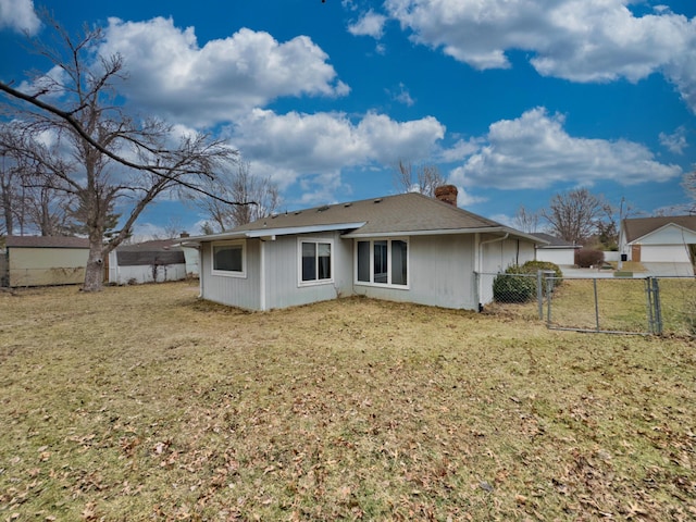 back of house with a yard