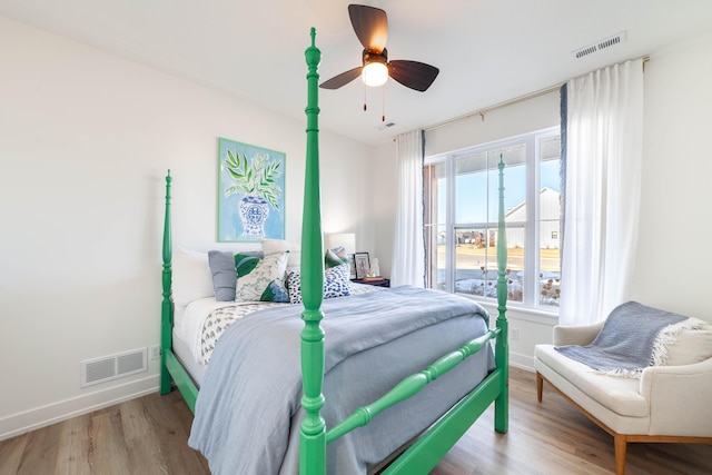 bedroom with ceiling fan and light hardwood / wood-style flooring