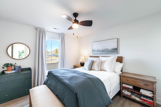 bedroom with wood-type flooring and ceiling fan